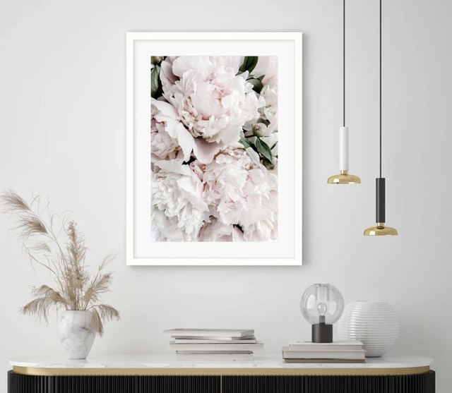 A floral print in a white frame